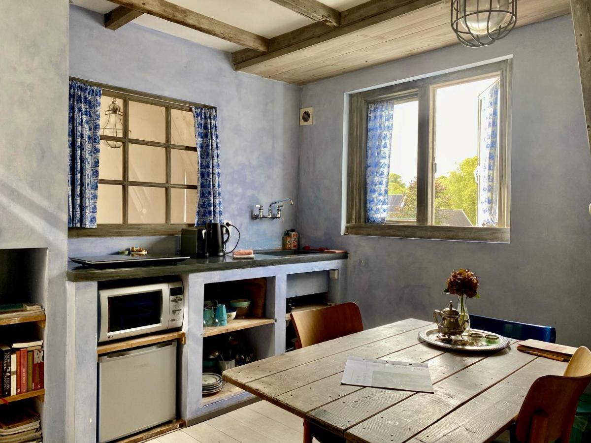 In De Aap - Appartementen & Guesthouse 卑尔根 外观 照片